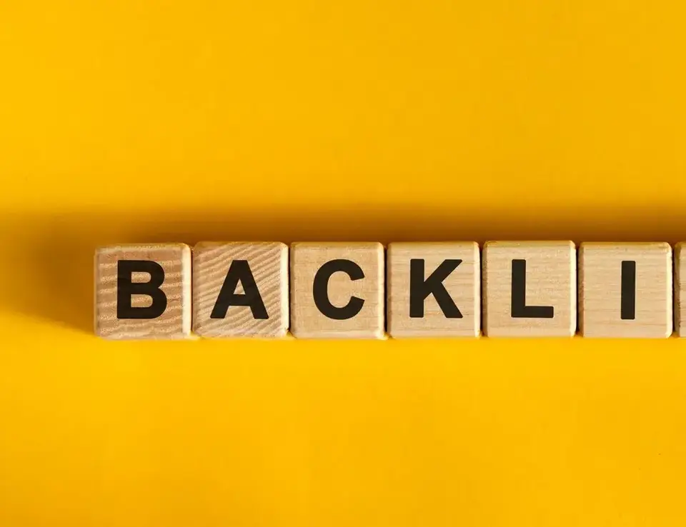 a wooden blocks with black letters on a yellow background