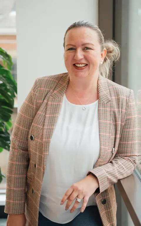 a woman smiling at camera