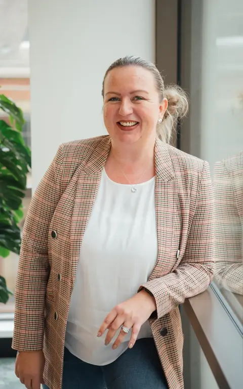 a woman smiling at camera