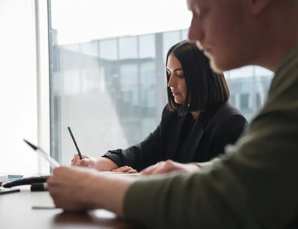 a man and woman sitting at a table