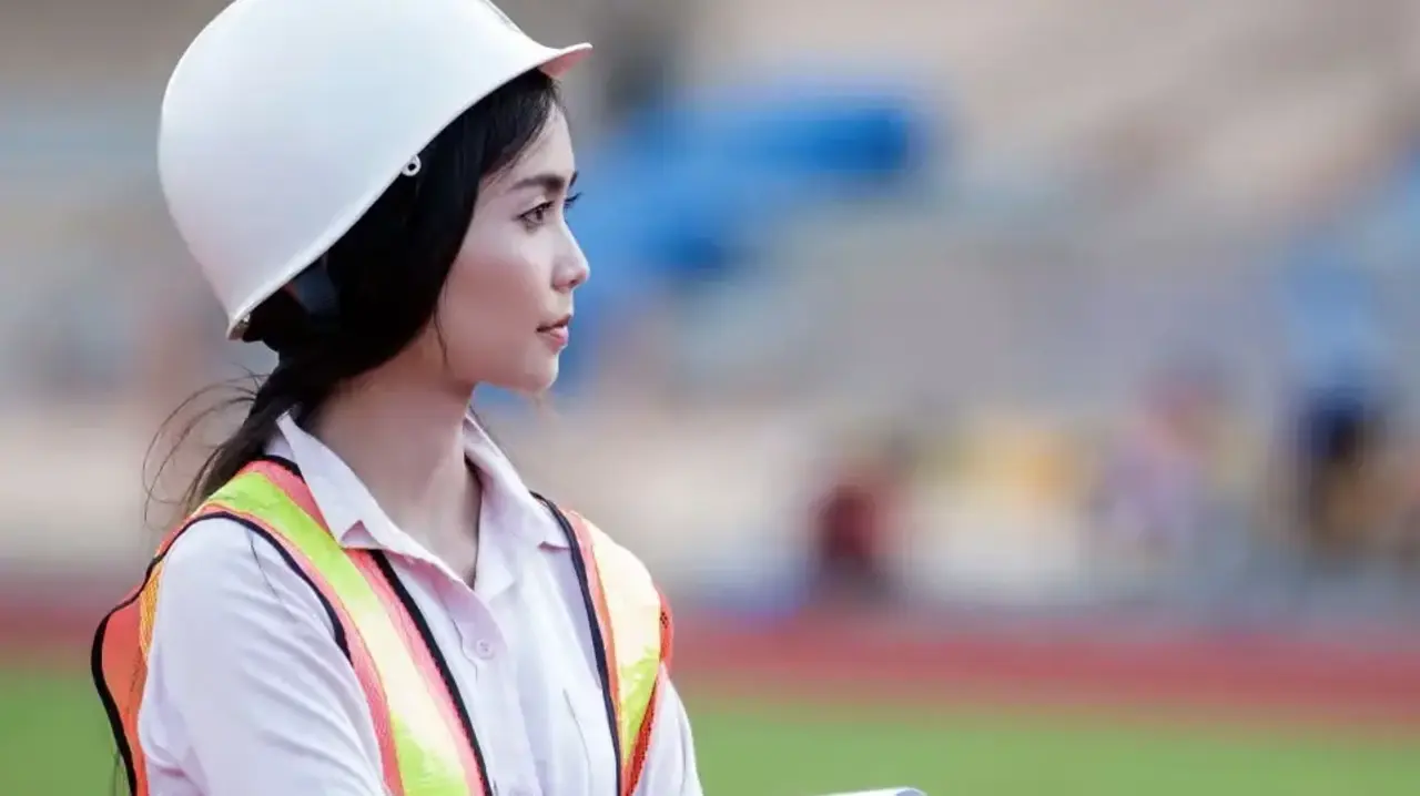 A woman wearing a helmet and a vest