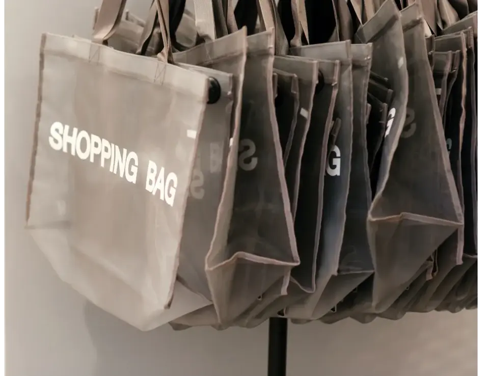a group of bags on a rack