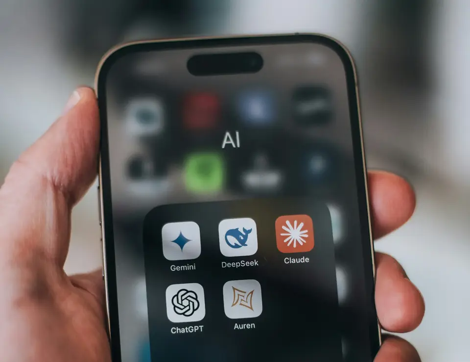 a hand holding a cell phone
