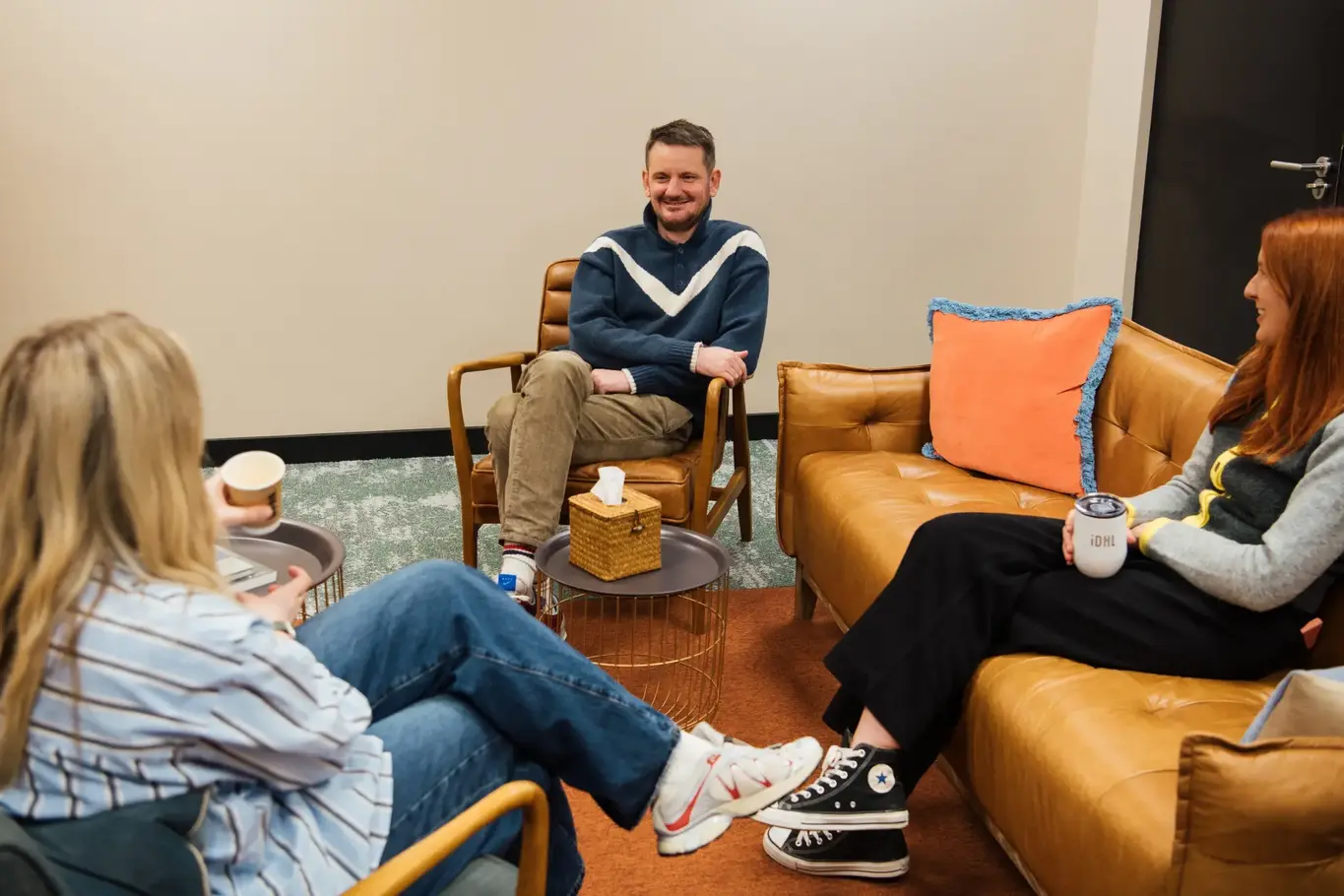 a group of people sitting in chairs