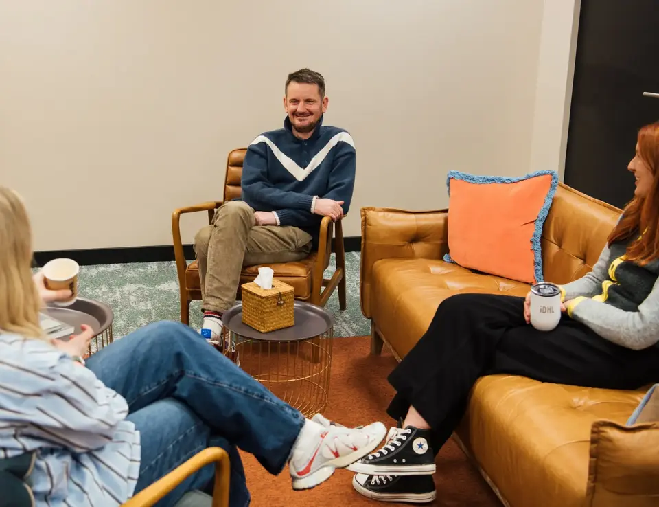 a group of people sitting in chairs