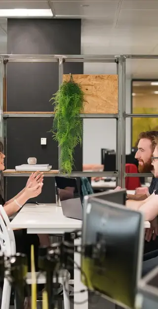a group of people sitting at a table