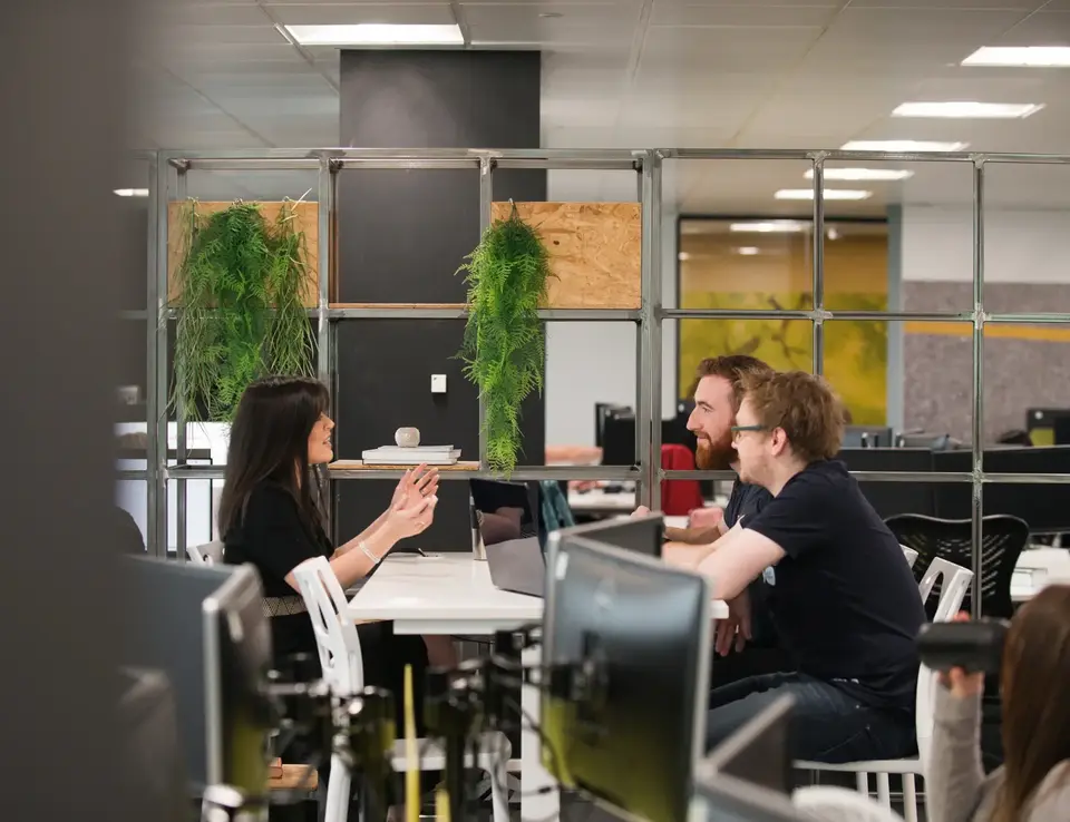 a group of people sitting at a table