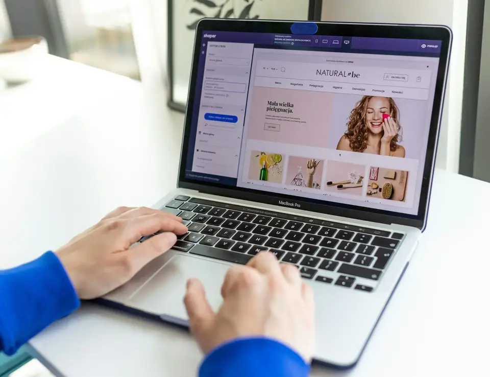 a person typing on a laptop