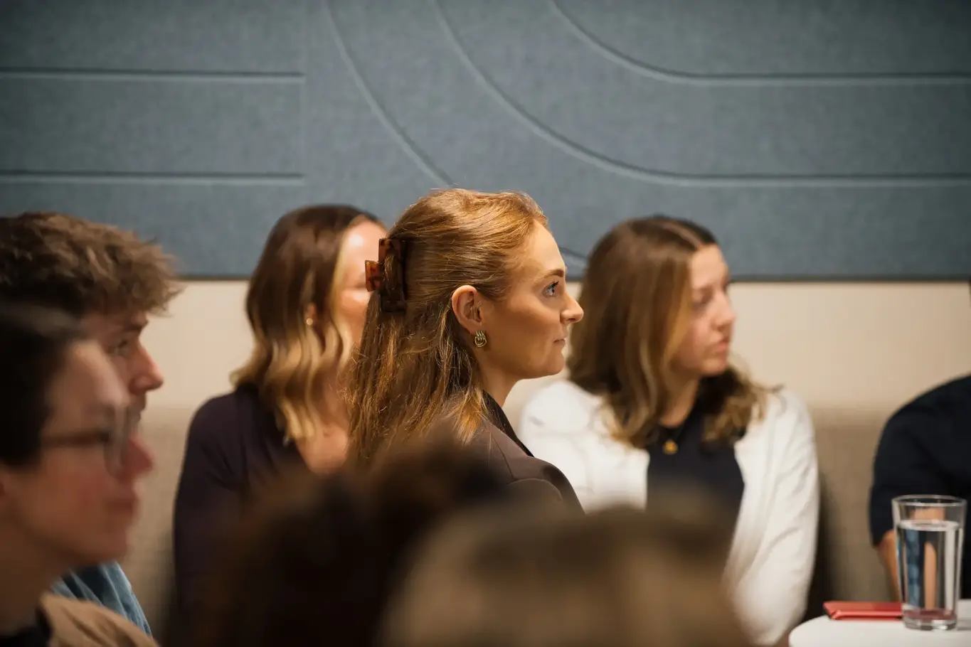 a group of women sitting in a room