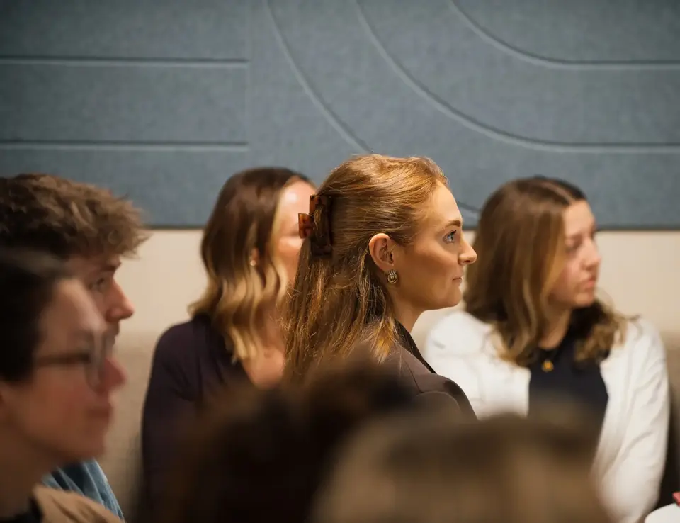 a group of women sitting in a room