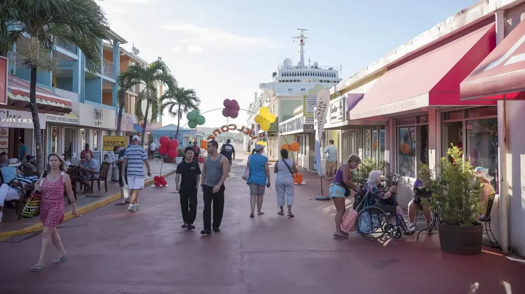a group of people walking down a sidewalk