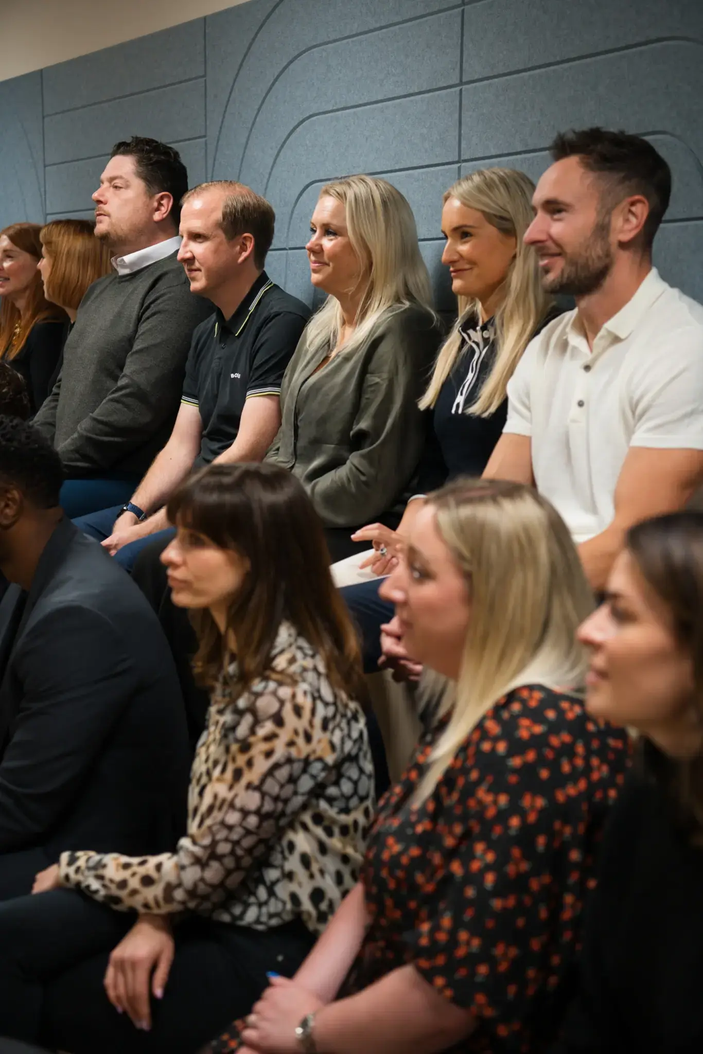 a group of people sitting in a row