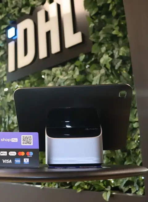 a tablet and a card on a table