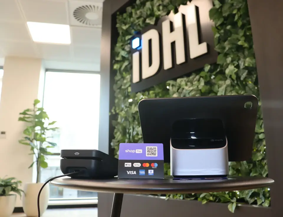 a tablet and a card on a table