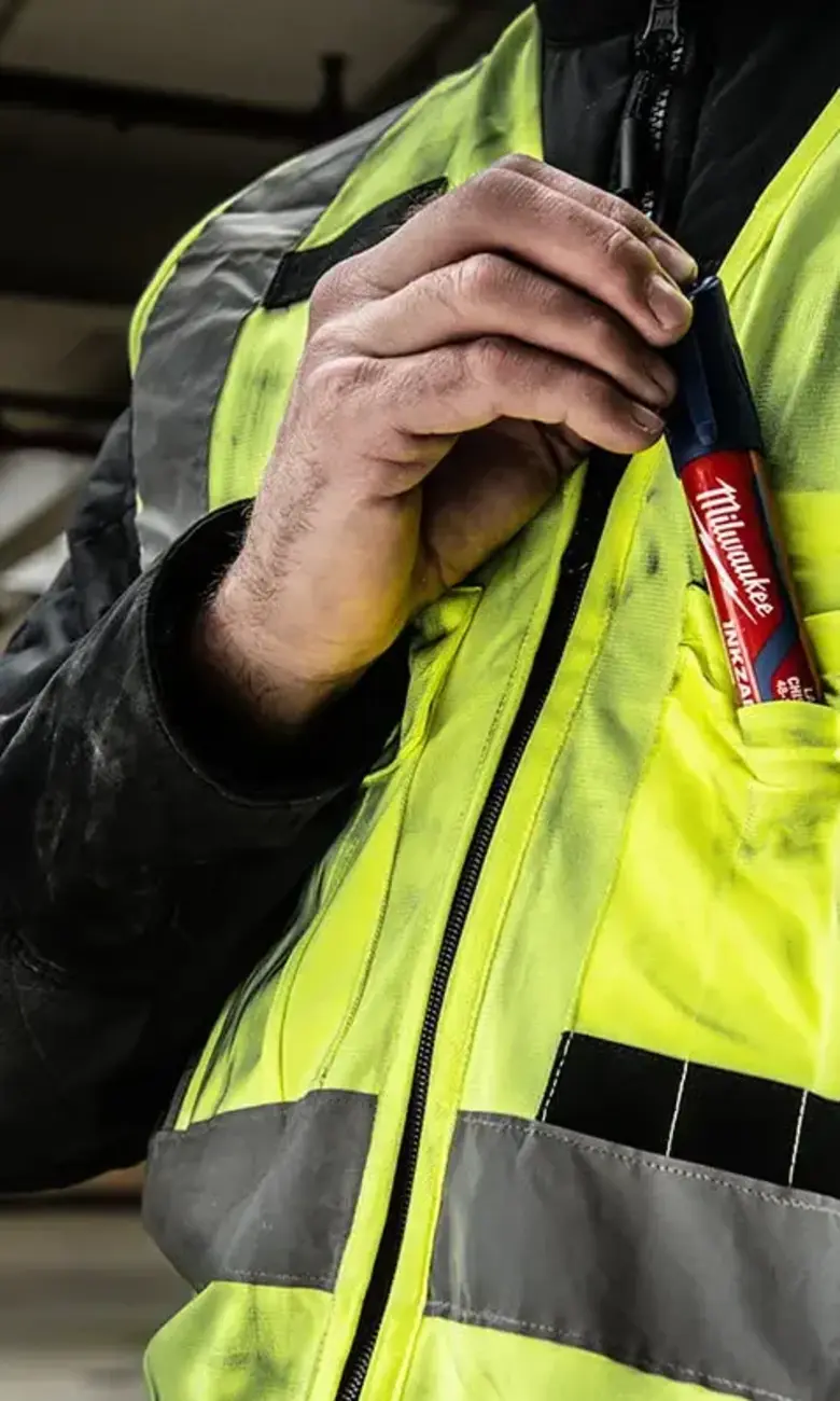 a person in a yellow vest