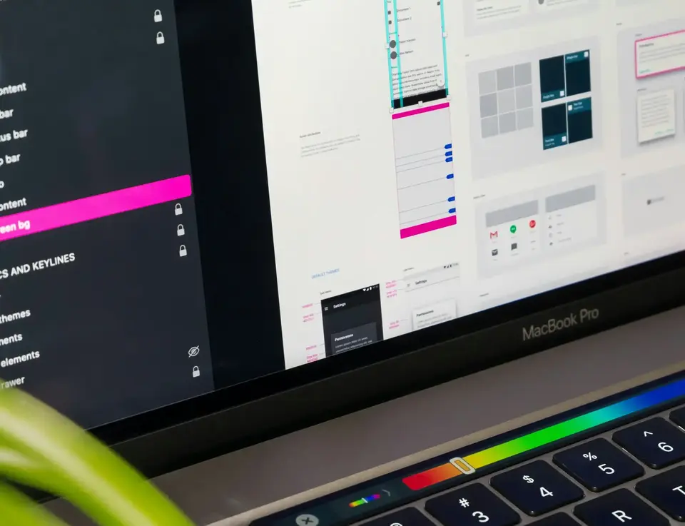a computer screen with a keyboard and a green pencil