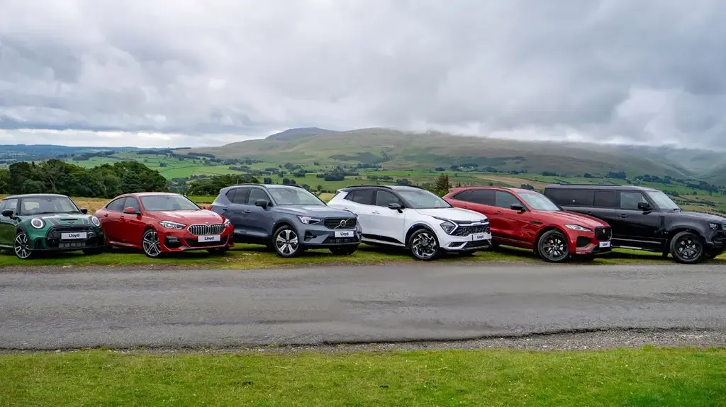 a group of cars parked on a road