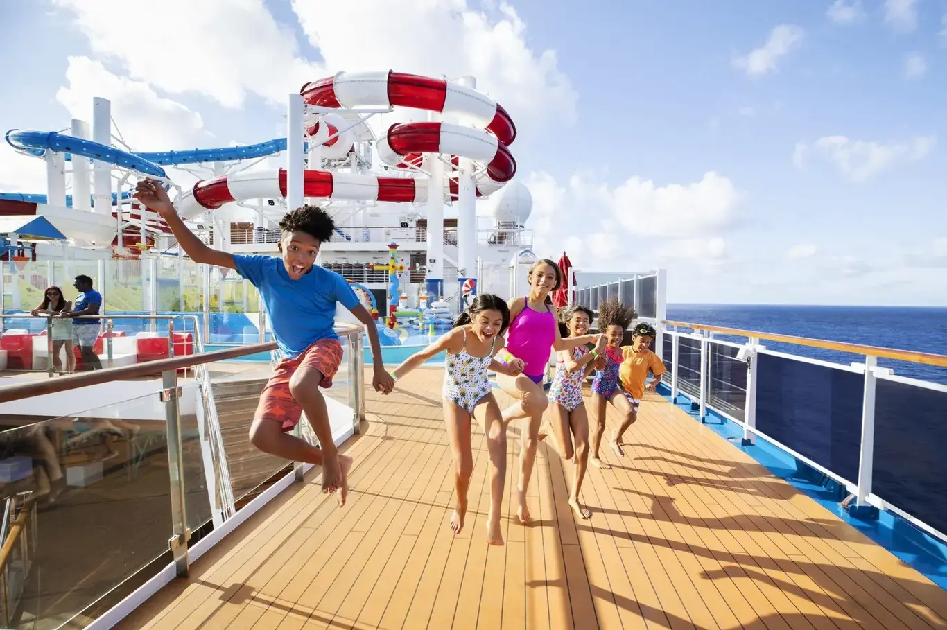 a group of kids jumping on a boat