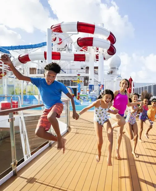 a group of kids jumping on a boat
