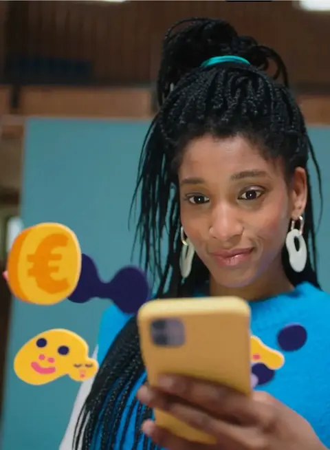 a woman holding a phone