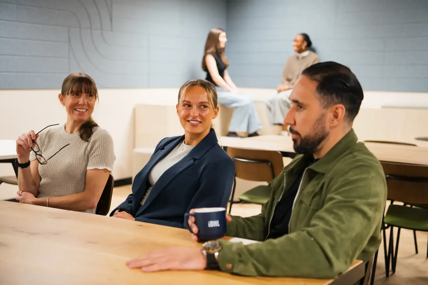 a group of people sitting at a table