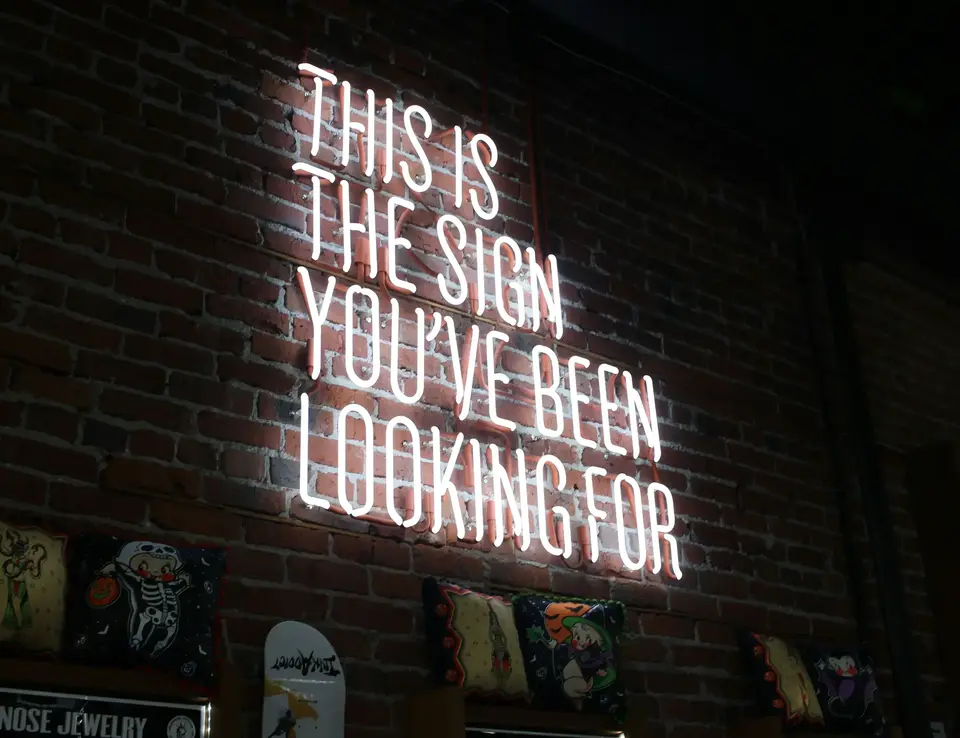 a sign on a brick wall