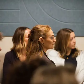 a group of women sitting in a room