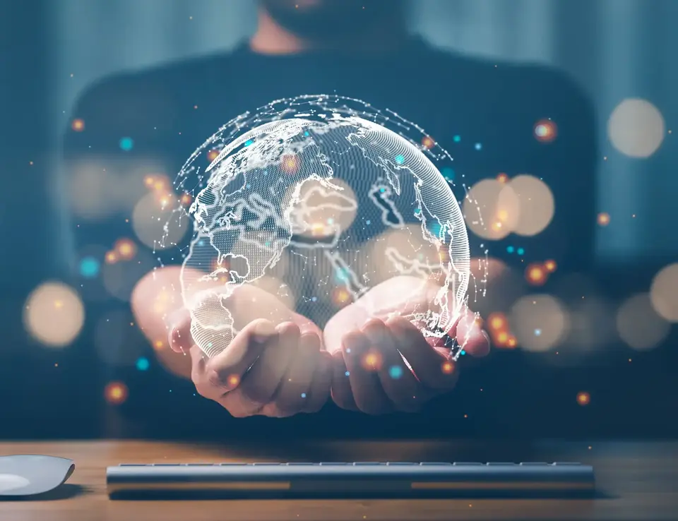 a person holding a digital globe