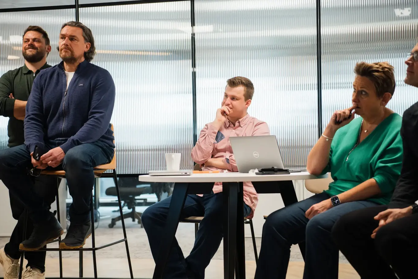a group of people sitting at a table