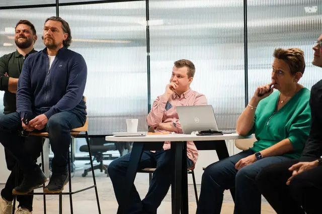 a group of people sitting at a table