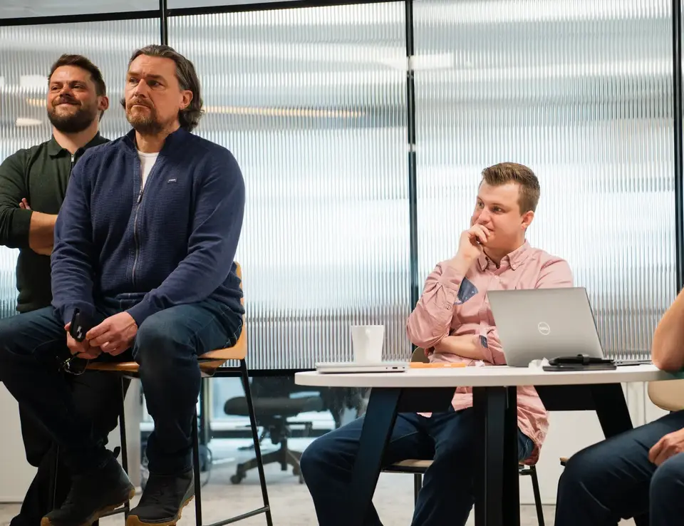 a group of people sitting at a table