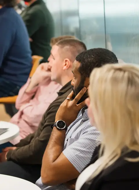 a group of people sitting in a room