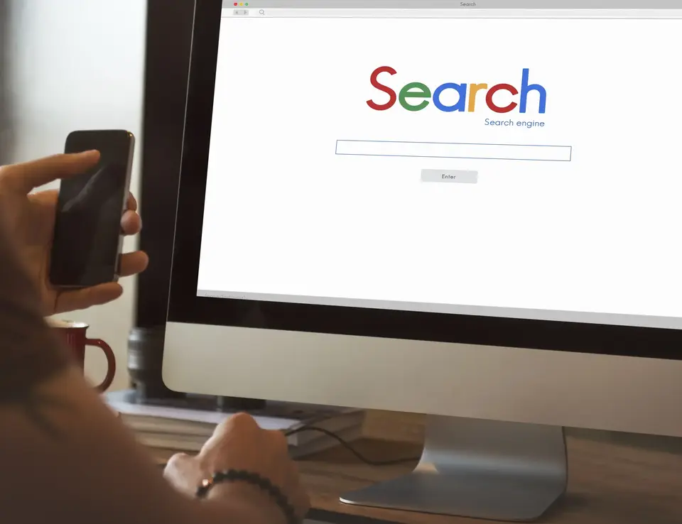 a person looking at a computer screen