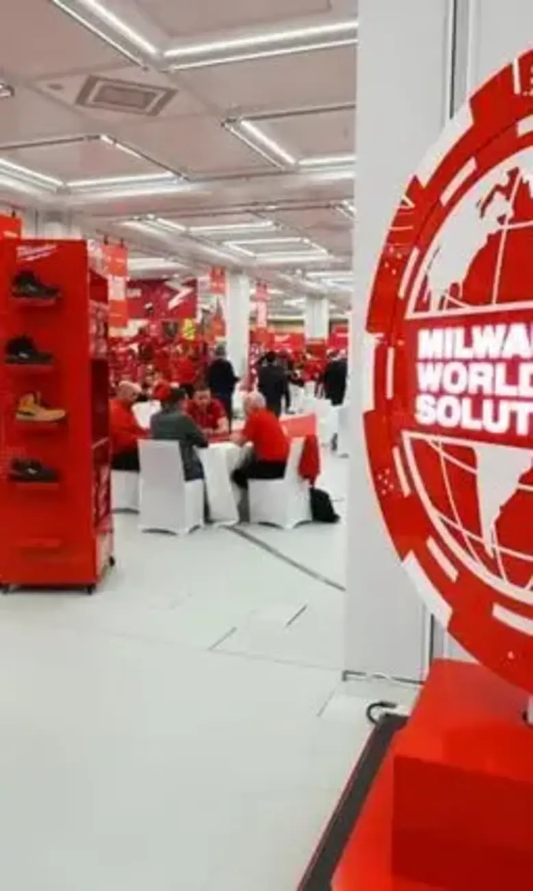 a group of people sitting at tables in a store