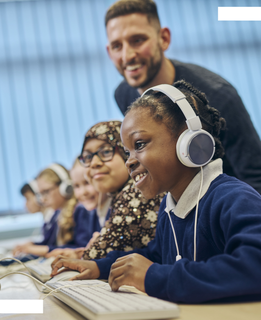 Young children wearing headphones in a classroom