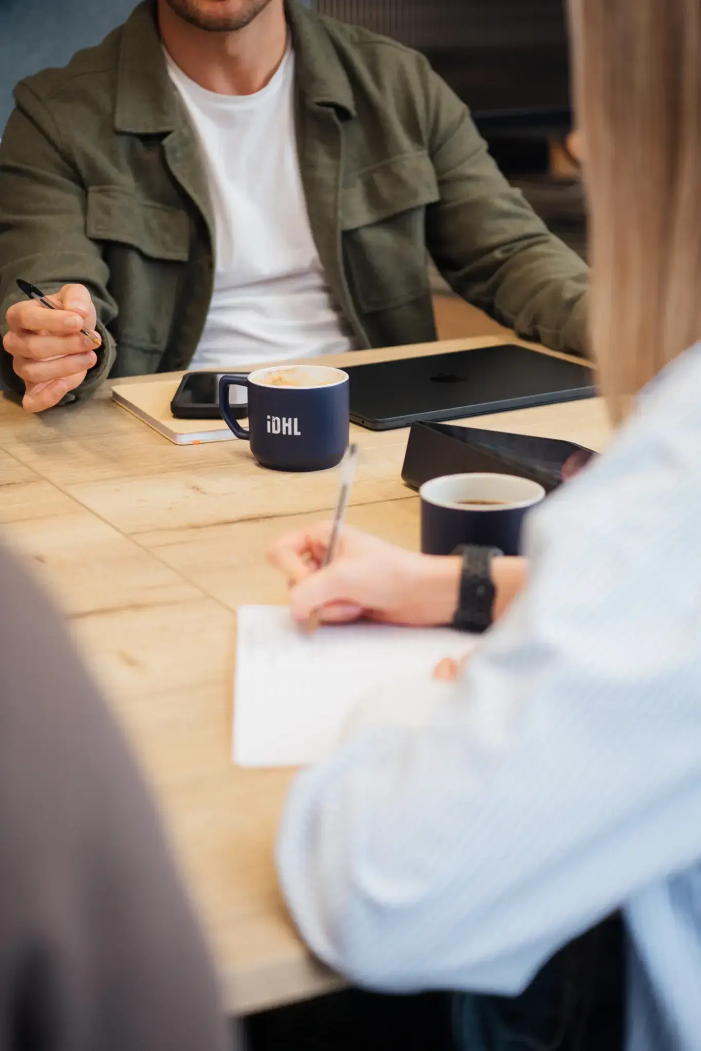 IDHL mugs on a table