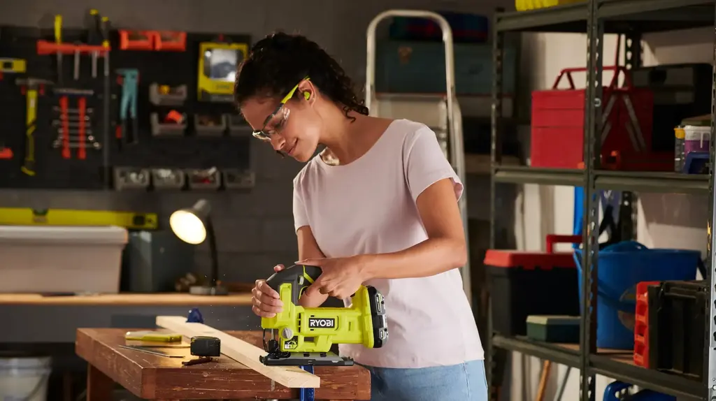 a woman using a power tool