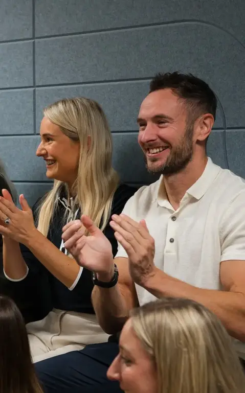 a group of people clapping