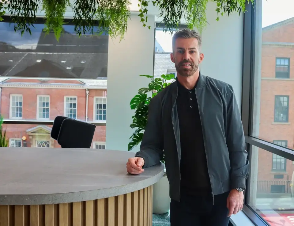 A man leaning on a table