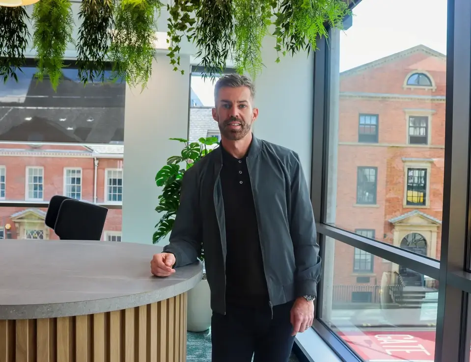 A man leaning on a table 