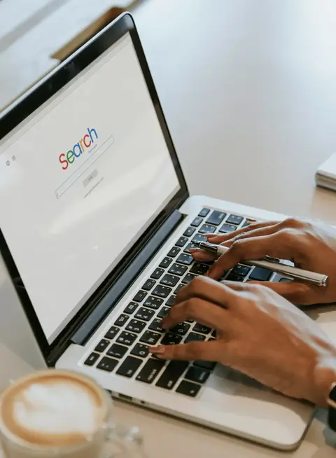 a person typing on a laptop