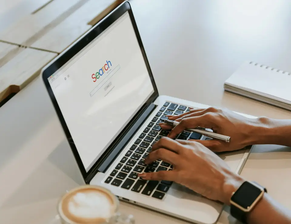 a person typing on a laptop