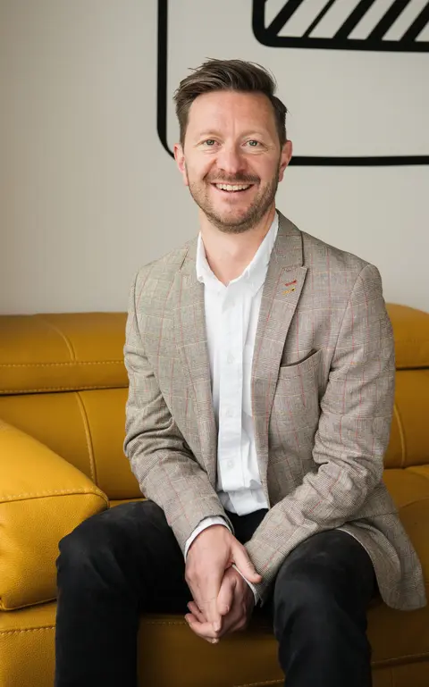 a man sitting on a couch