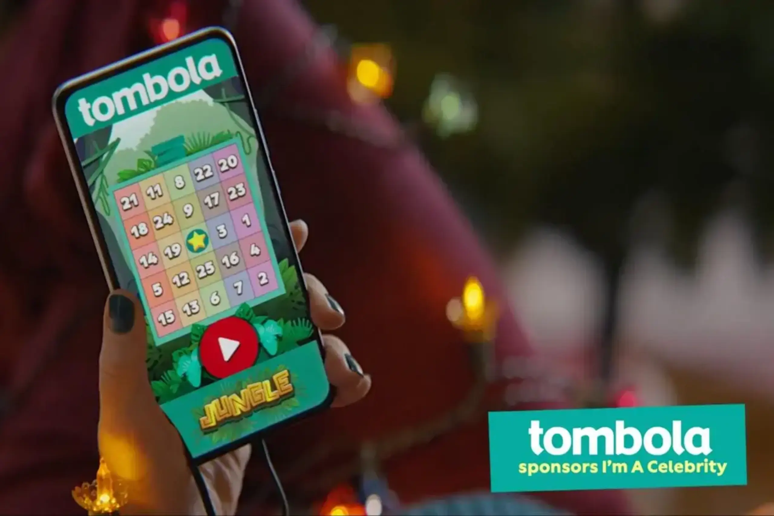 a hand holding a phone with a game on it