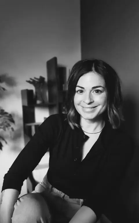 a woman smiling at camera