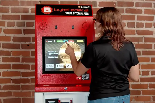 Woman using Byte Federal bitcoin ATM