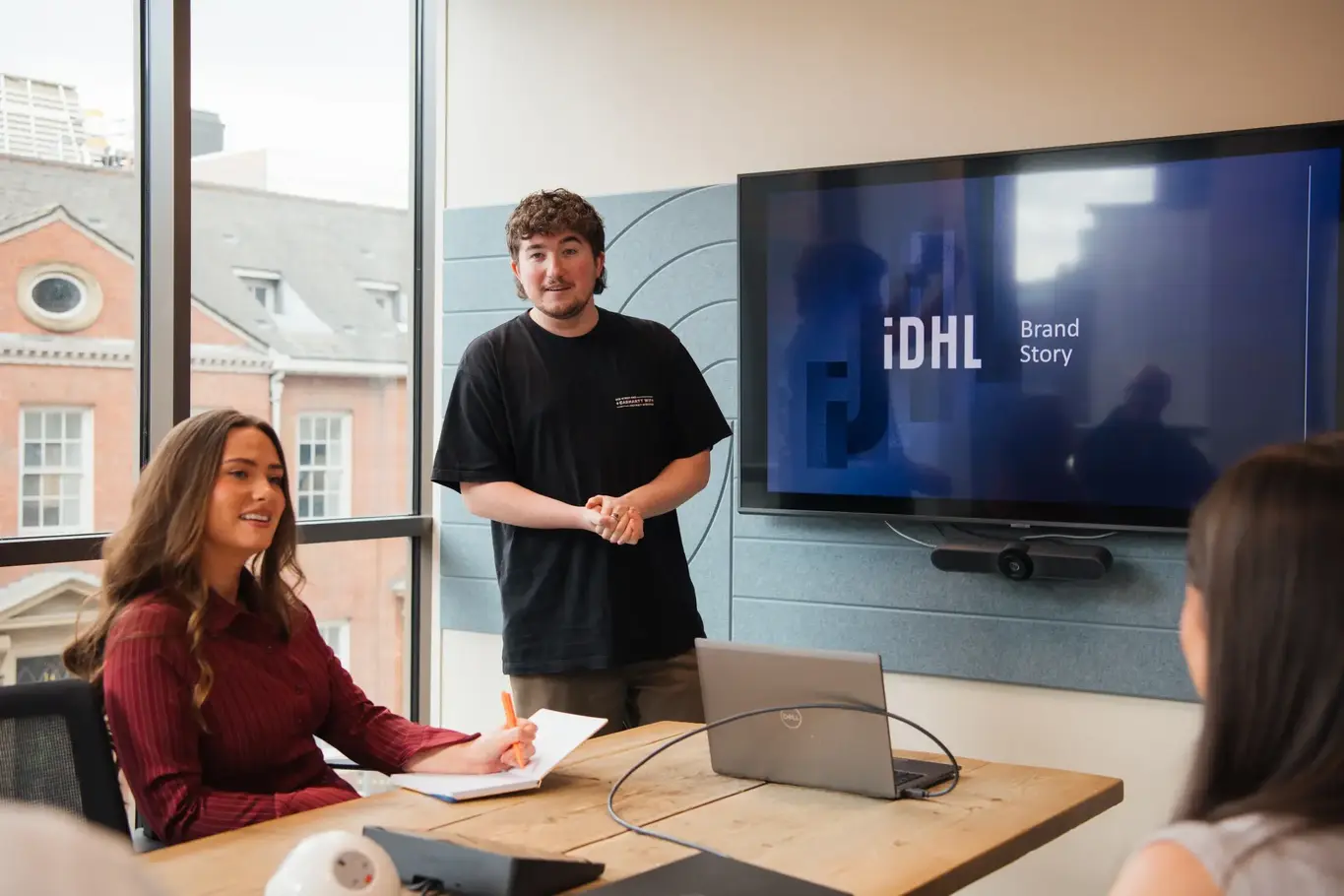 IDHL employees in a meeting