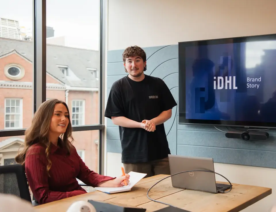 IDHL employees in a meeting