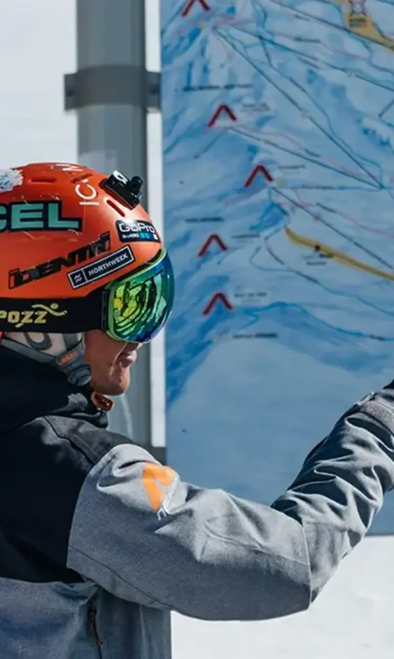 Neilson ski instructor pointing to a map