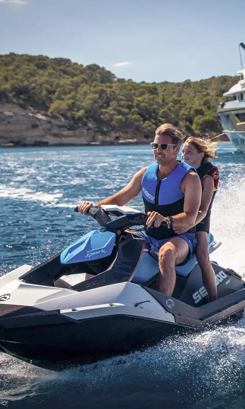 a man and woman on a jet ski